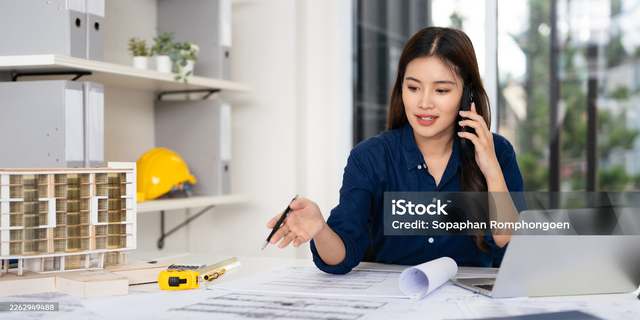 Hawkins-Weir engineer on a call with a client, reviewing drawings